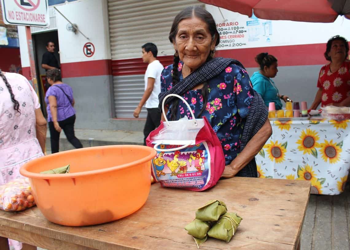 Colorful street market scene in Cozumel Mexico near Stingray Villa, showcasing local vendors and traditional products. Authentic Mexican shopping experience on vacation in Cozumel.