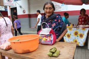 Colorful street market scene in Cozumel Mexico near Stingray Villa, showcasing local vendors and traditional products. Authentic Mexican shopping experience on vacation in Cozumel.