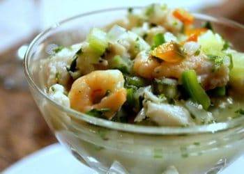 Fresh shrimp ceviche with chopped vegetables in a glass bowl, showcasing a delicious Caribbean seafood dish from Cozumel, Mexico. Perfect for vacation renters at Stingray Villa seeking local cuisine experiences.