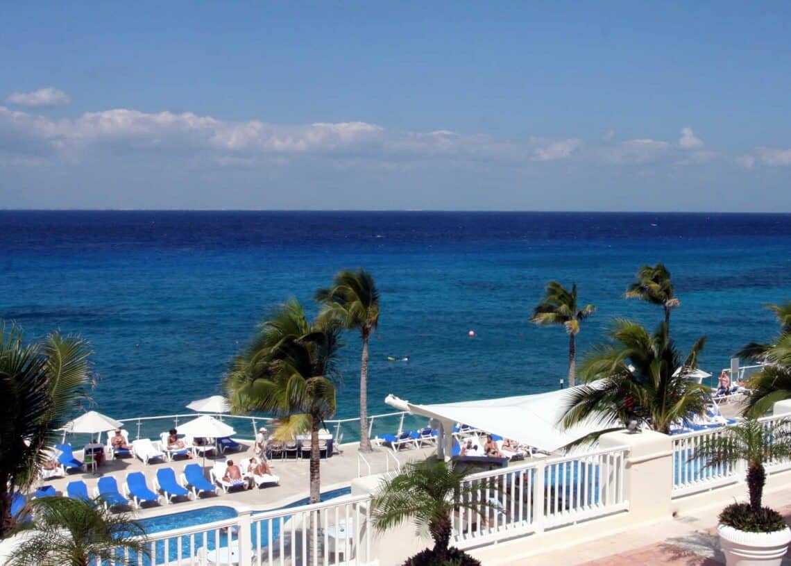 Beautiful ocean view near Stingray Villa with pool and palm trees on the terrace