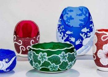 Vibrant hand-painted glass lanterns with ocean and floral themes, perfect for summer decor in Cozumel Mexico at Stingray Villa vacation rental.