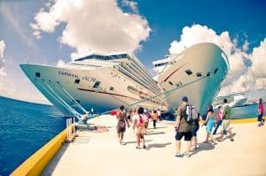 Luxury cruise ships at Cozumel Mexico dock, popular vacation destination for Stingray Villa guests. Cruise tourists enjoy the beautiful port, vibrant atmosphere, and island excursions.