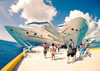 Luxury cruise ships at Cozumel Mexico dock, popular vacation destination for Stingray Villa guests. Cruise tourists enjoy the beautiful port, vibrant atmosphere, and island excursions.