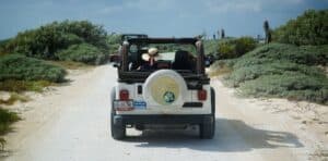 Driving through the scenic dirt road to Stingray Villa on Cozumel Mexico, perfect for an adventurous vacation rental experience.