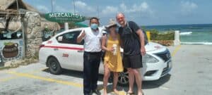 Alex the Cozumel taxi tour at Cozumel, Mexico with tourists enjoying the beach, featuring a taxi, ocean views, and local dining spots like Mezcalito's.