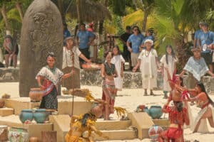 Vibrant traditional Mayan dance performance on the beaches of Cozumel, Mexico near Stingray Villa vacation rental, showcasing local culture and colorful costumes.