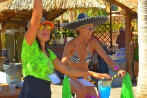 Colorful women enjoying a sunny day at Cozumel Mexico, with tropical decor and beach accessories, perfect for a relaxing vacation in the best vacation rental.