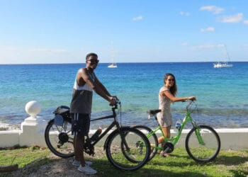 Sunset Ride in Cozumel Mexico at Stingray Villa vacation rental with friends cycling along the beach. Enjoy ocean views and tropical scenery, perfect for a relaxing getaway.
