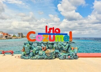 Colorful Cozumel island sign by the ocean in Mexico, vibrant travel destination.