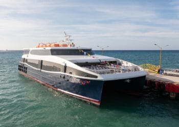 Luxury catamaran ferry docked at the pier in Cozumel.