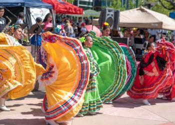 Colorful traditional Mexican dancers performing during a lively festival.