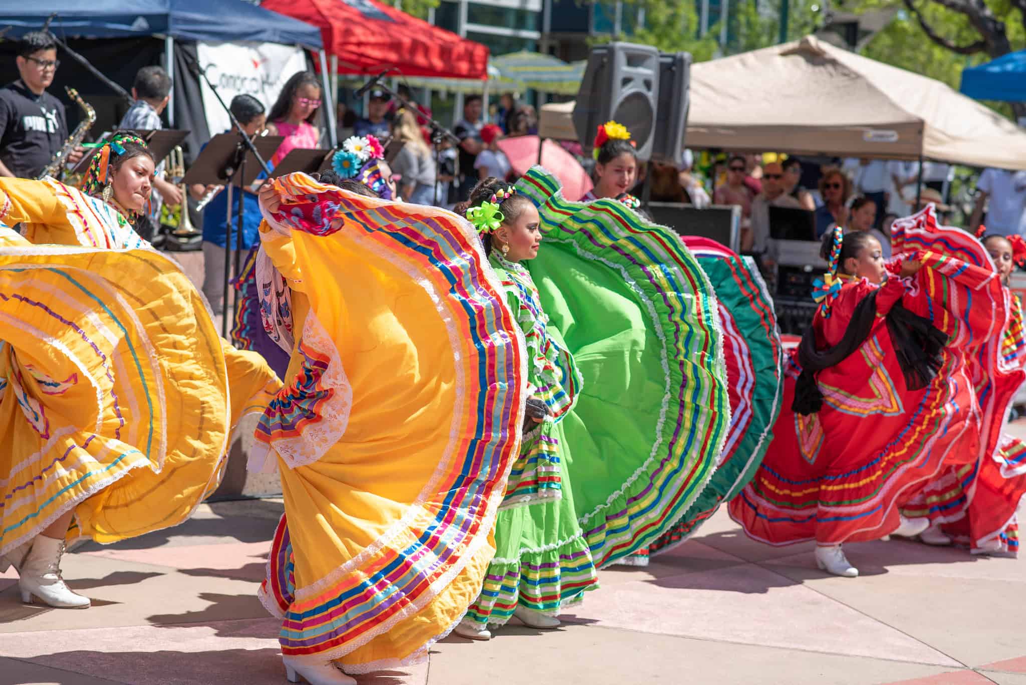 Colorful traditional Mexican dancers performing during a lively festival.
